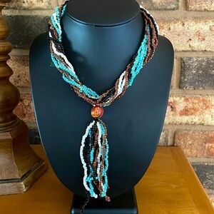 Vintage 10 strand seed bead white black blue brown & wooden carved bead & tassel